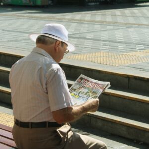 An Old Man Reading Newspaper
