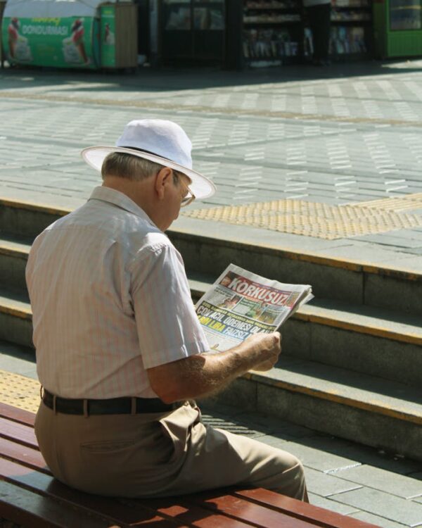 An Old Man Reading Newspaper
